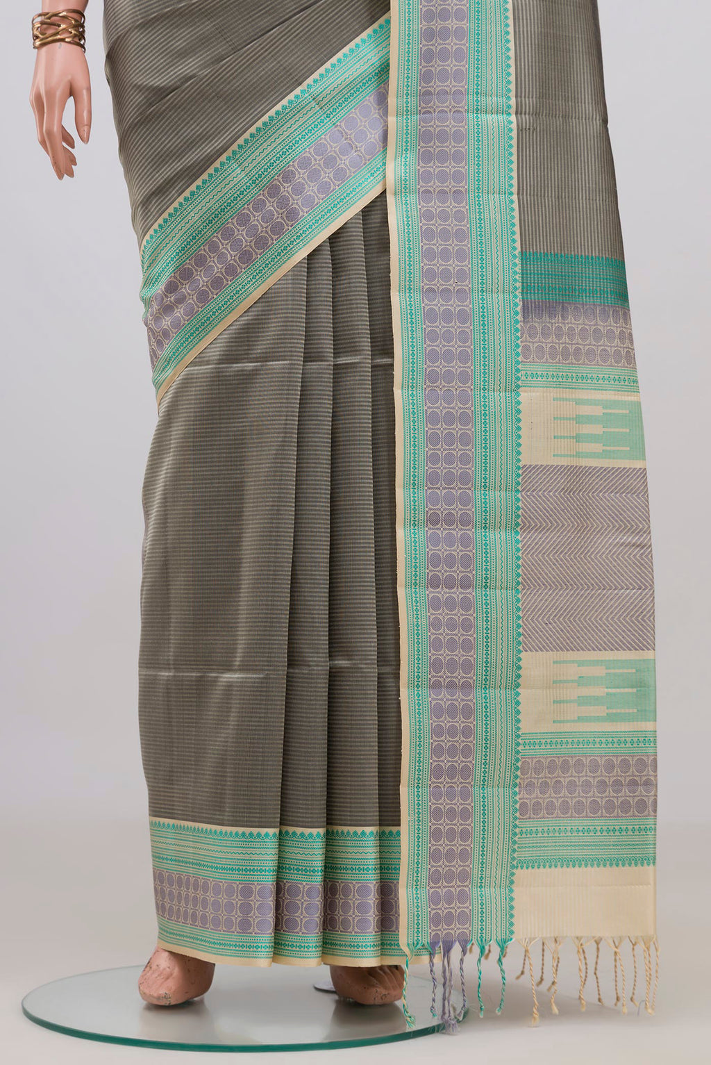Pleats and pallu of Pure Silk Grey Soft Saree with Stripes on the body and Thread Border. 
