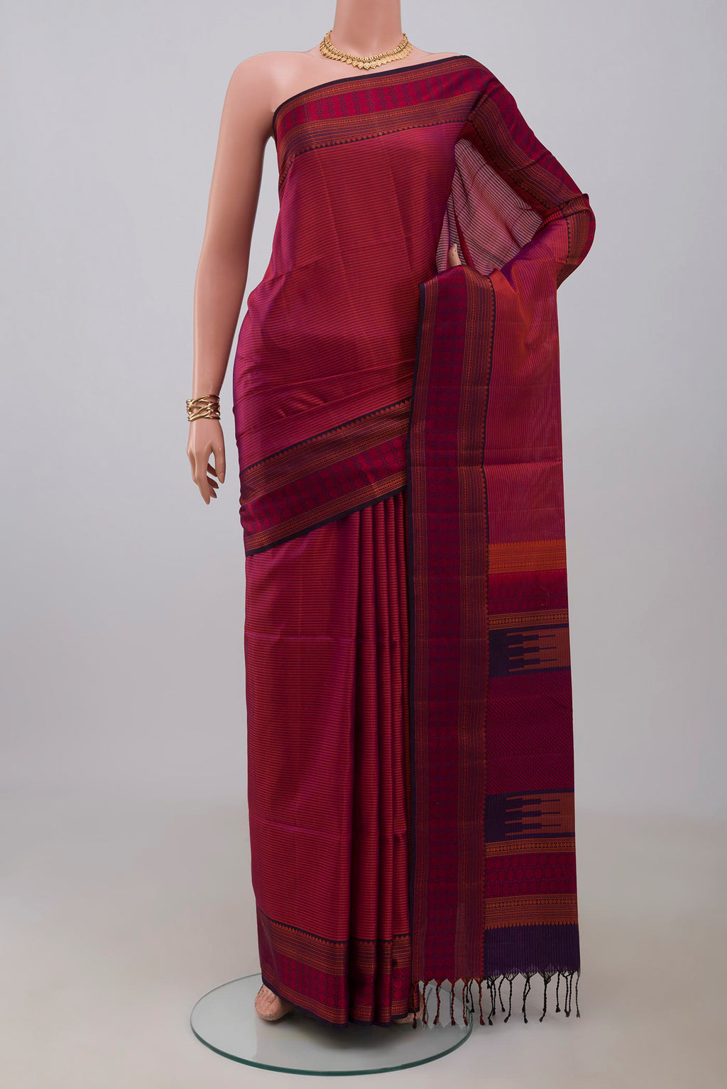 Magenta Dual Tone Soft Silk Saree with Stripes on the body and Thread Border.  displayed on a mannequin