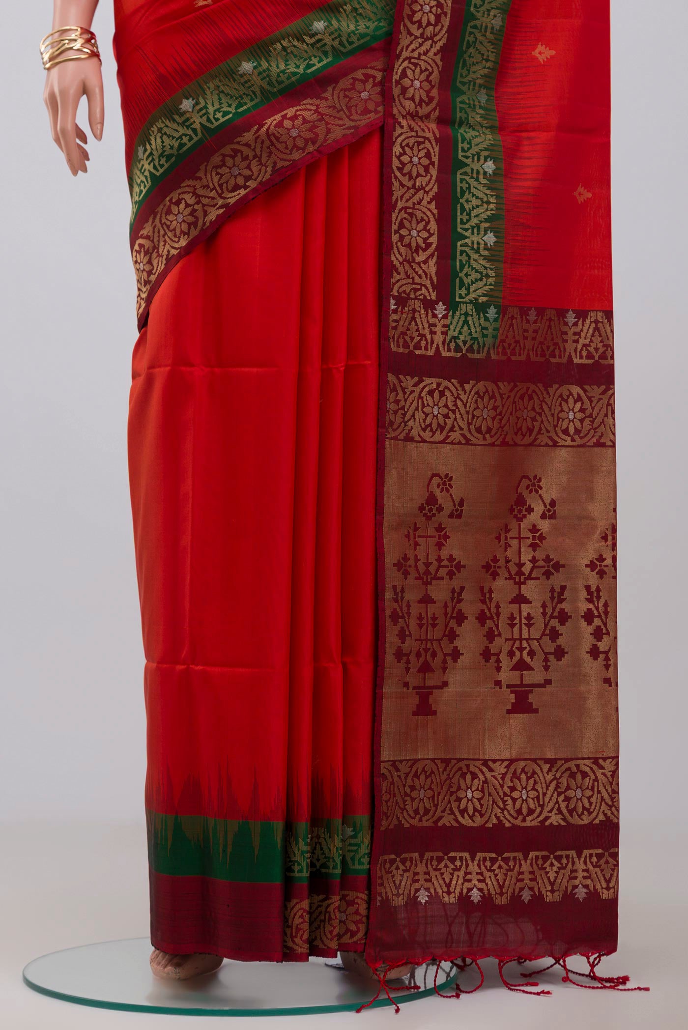 Pleats and pallu of Red Soft Silk Saree with Zari Butta on the body and Fancy Border. 
