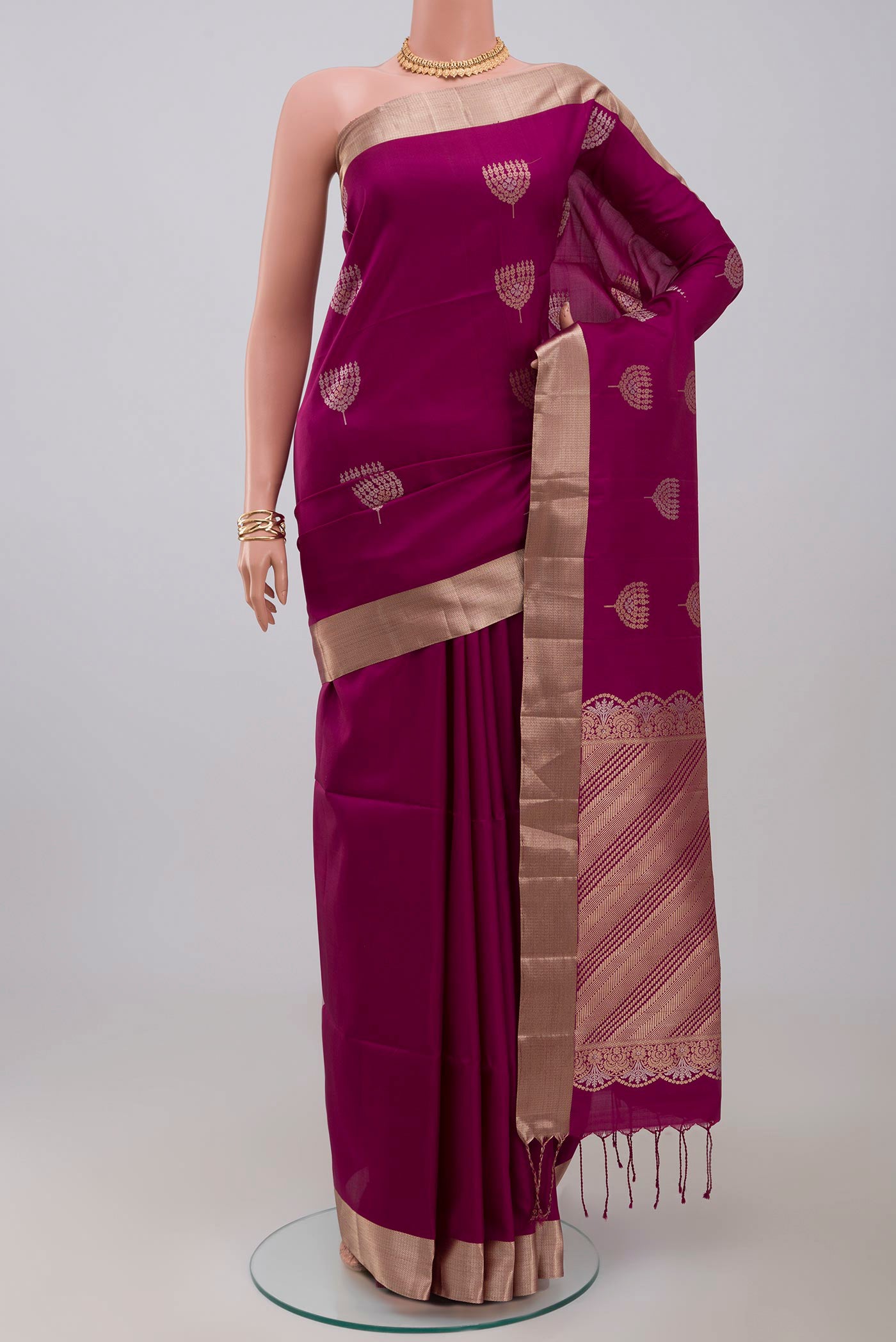 Purple Soft Silk Saree with Zari Butta on the body and Zari Border.  displayed on a mannequin