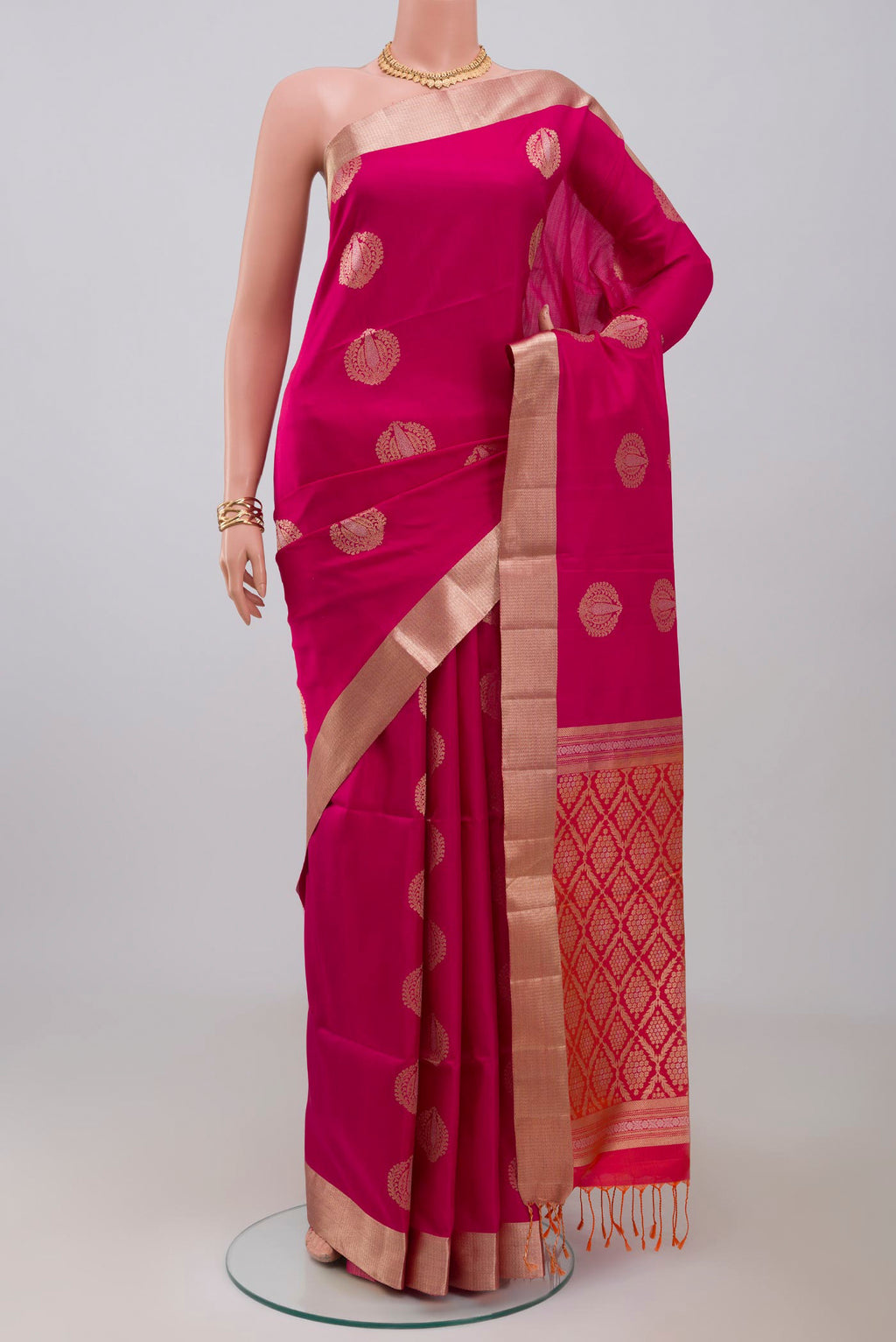 Pink Soft Silk Saree with Zari Butta on the body and Zari Border.  displayed on a mannequin