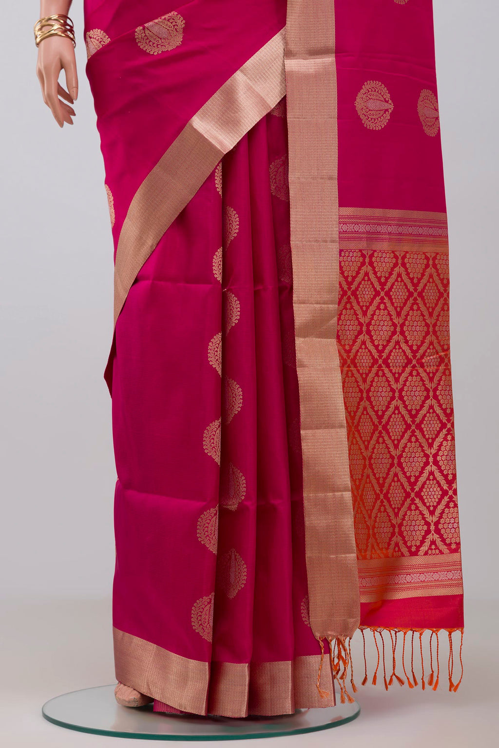 Pleats and pallu of Pink Soft Silk Saree with Zari Butta on the body and Zari Border. 