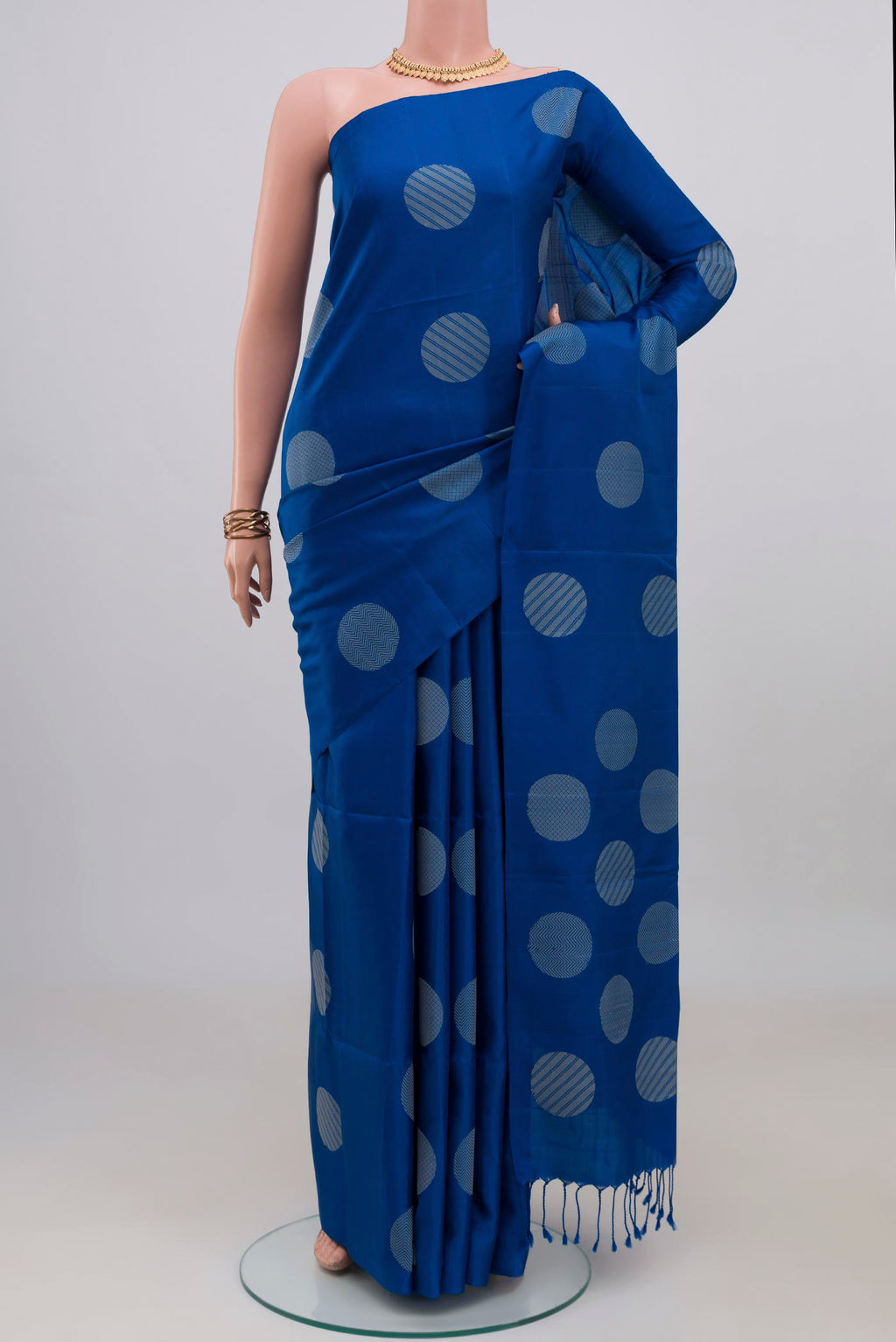Blue Soft Silk Saree with Thread Butta on the body and Without Border.  displayed on a mannequin
