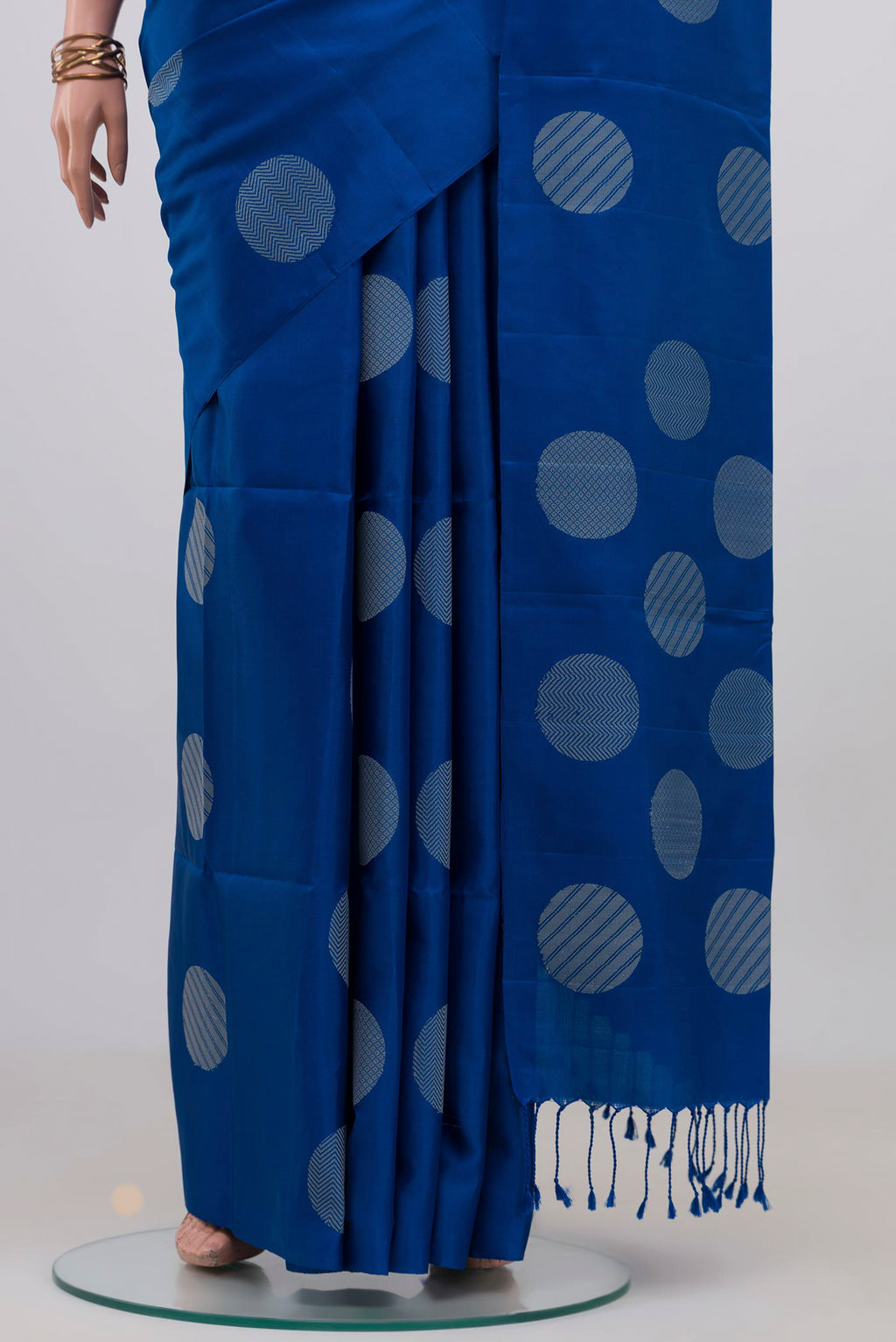 Pleats and pallu of Blue Soft Silk Saree with Thread Butta on the body and Without Border. 