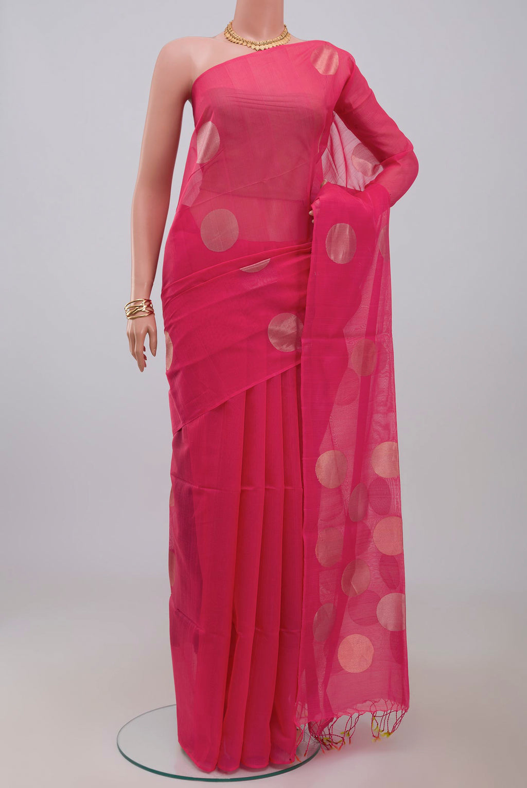 Pink Silk Cotton Saree with Zari Butta on the body and Without Border.  displayed on a mannequin