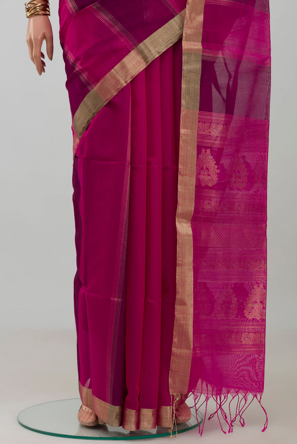 Pleats and pallu of Magenta Silk Cotton Saree with Stripes on the body and Zari Border. 