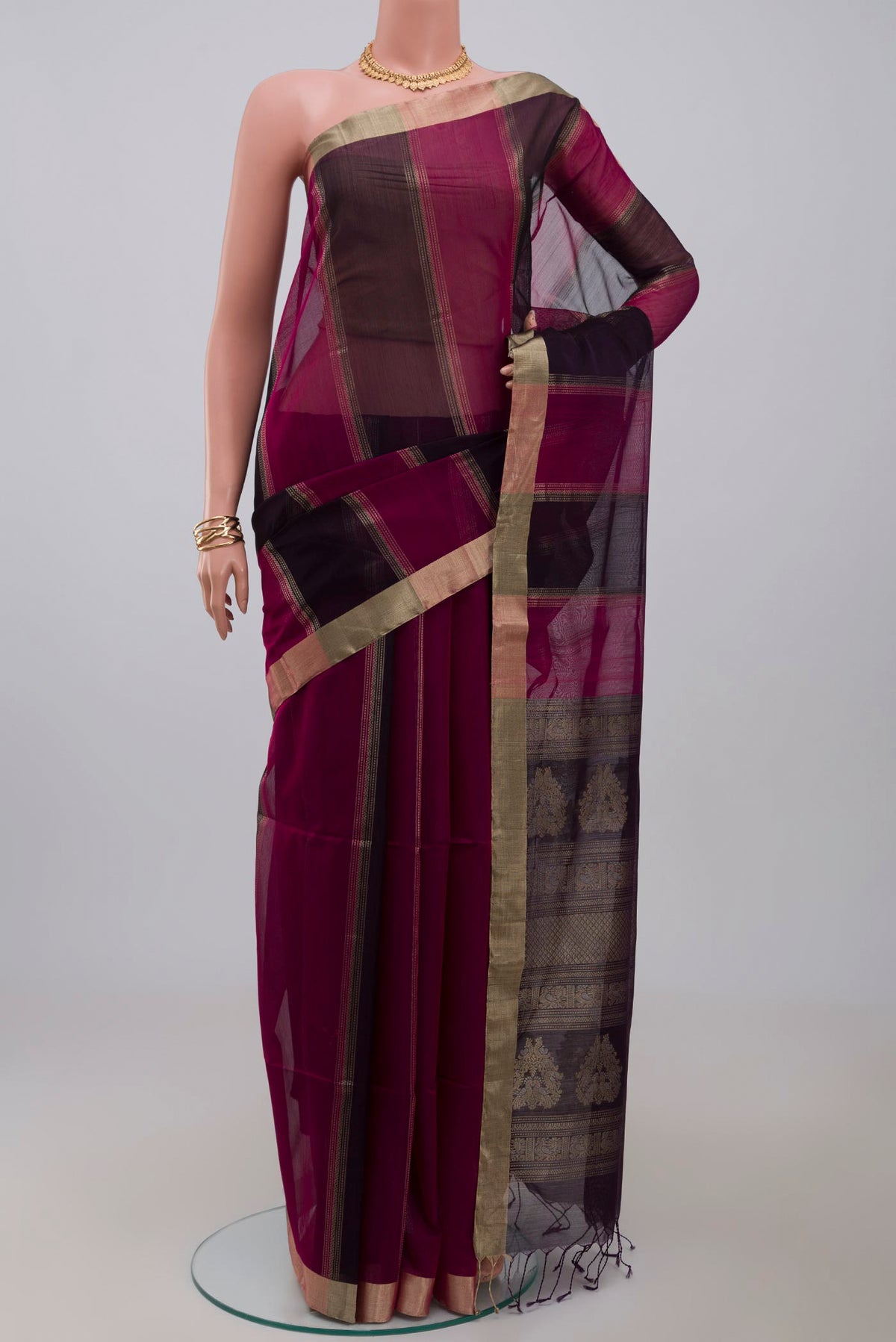 Multi Color Silk Cotton Saree with Fancy on the body and Zari Border.  displayed on a mannequin