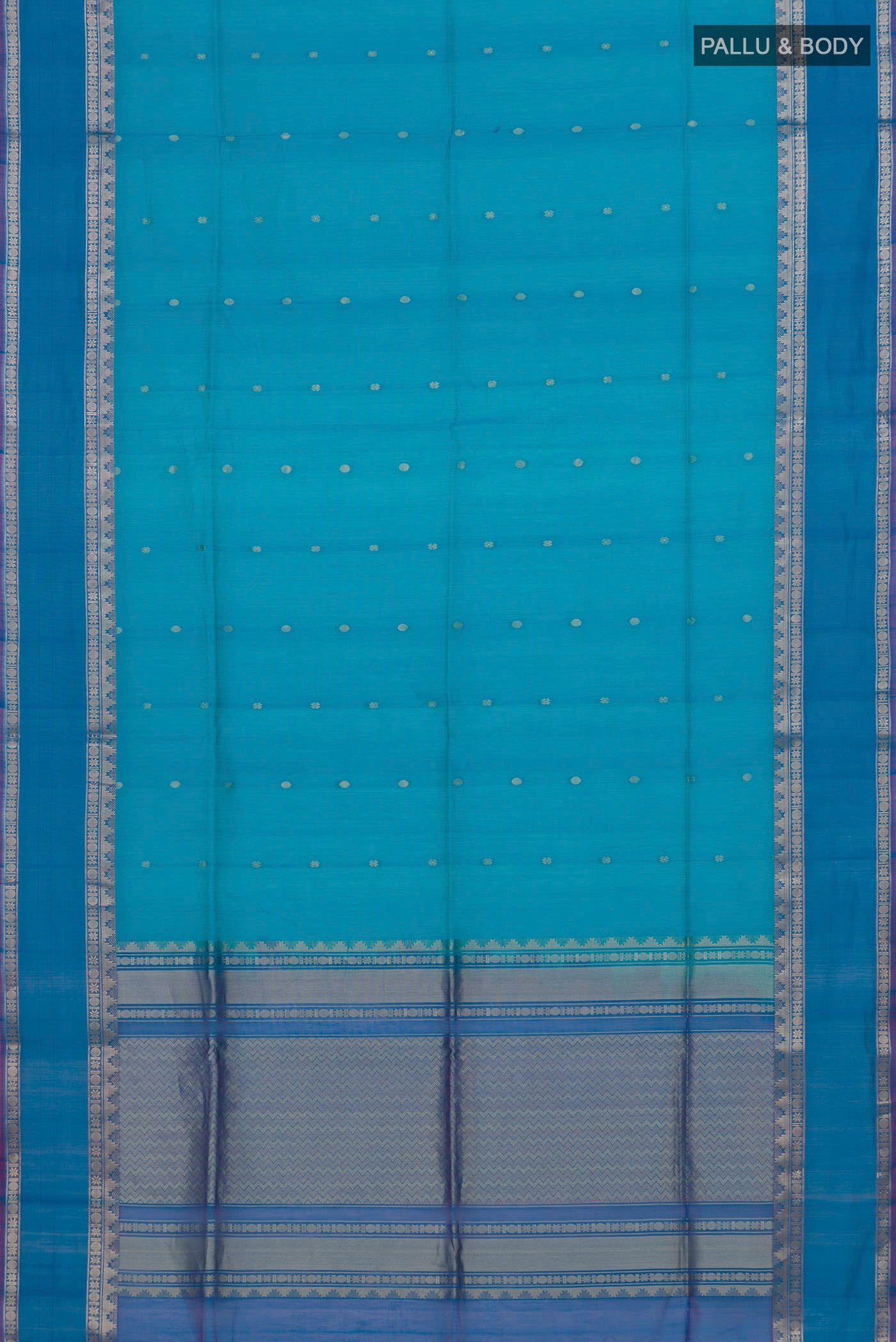 Flat view of Blue Silk Cotton Saree with Zari Butta on the body and Zari Border. 
