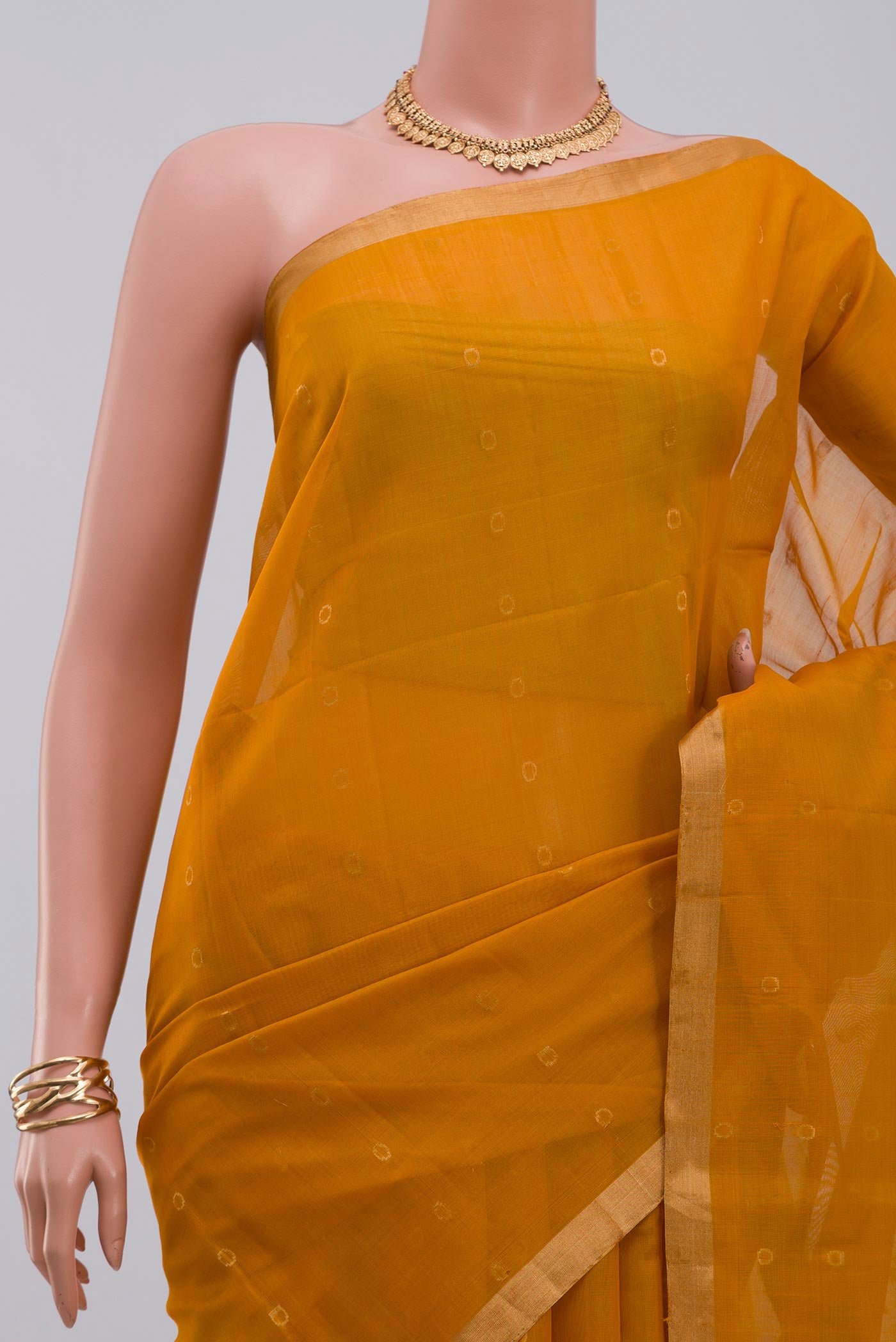 Border image of Yellow Silk Cotton Saree with Zari Butta on the body and Thin Zari Line. 