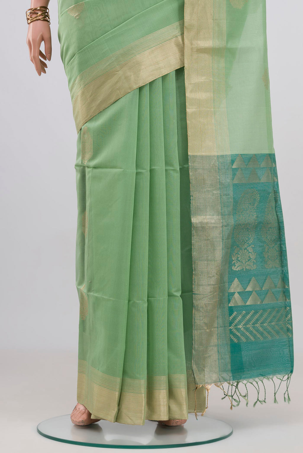 Pleats and pallu of Pista Green Silk Cotton Saree with Zari Butta on the body and Zari Border. 