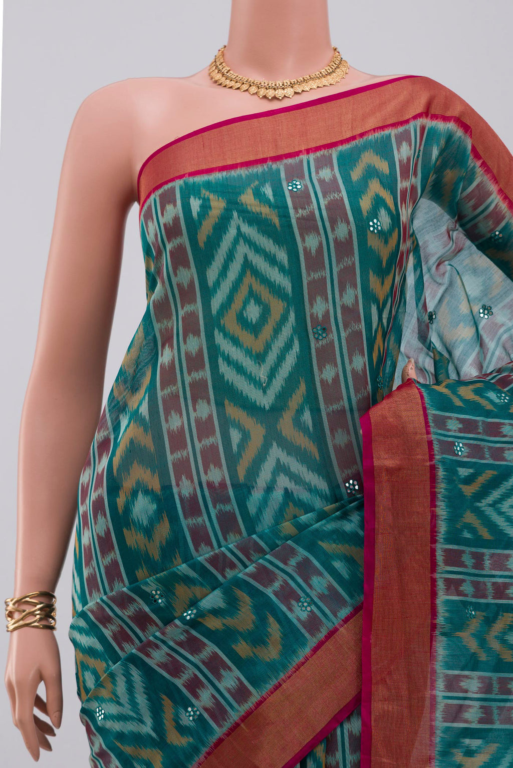 Border image of Green Silk Cotton Saree with Ikat Print on the body and Zari Border. 