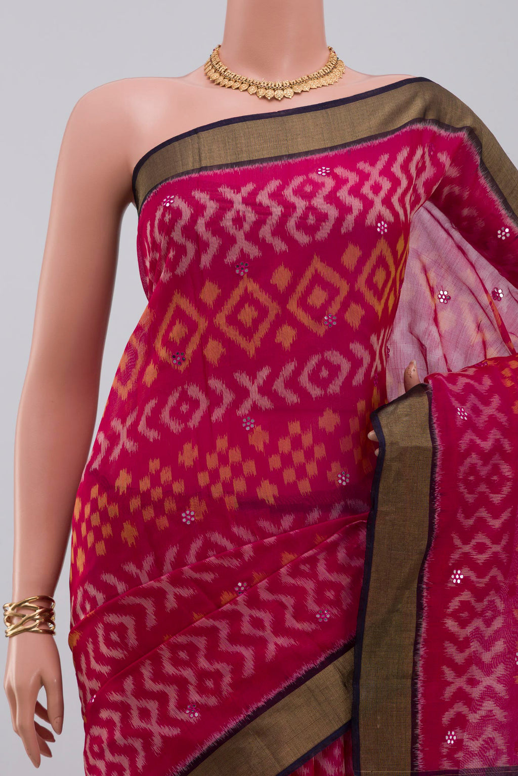Border image of Pink Silk Cotton Saree with Ikat Print on the body and Zari Border. 