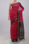 Pink Silk Cotton Saree with Ikat design on the body and Zari Border.  displayed on a mannequin