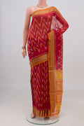 Red Silk Cotton Saree with Ikat Print on the body and Zari Border.  displayed on a mannequin