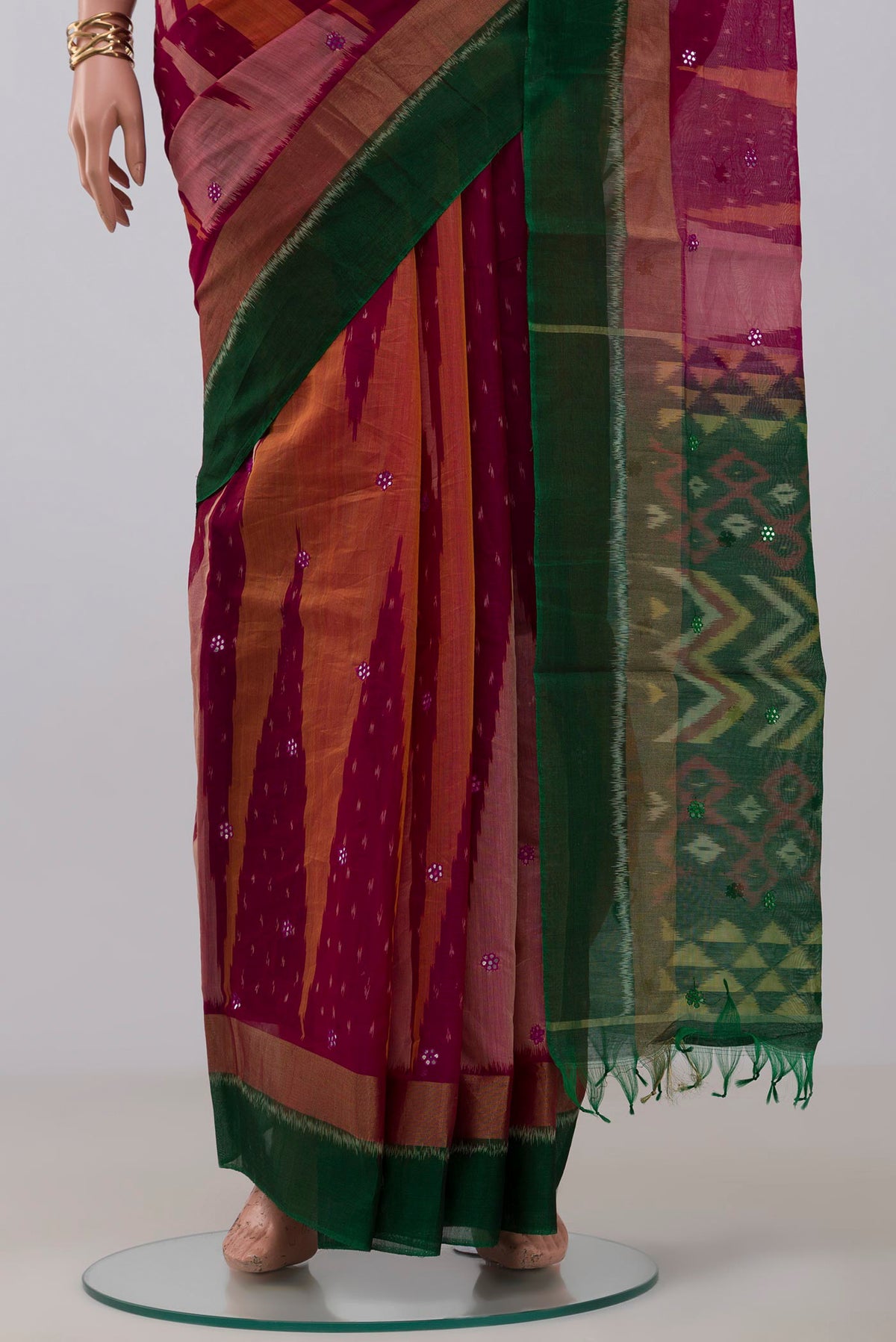 Pleats and pallu of Pink Silk Cotton Saree with Ikat Print on the body and Zari Border. 