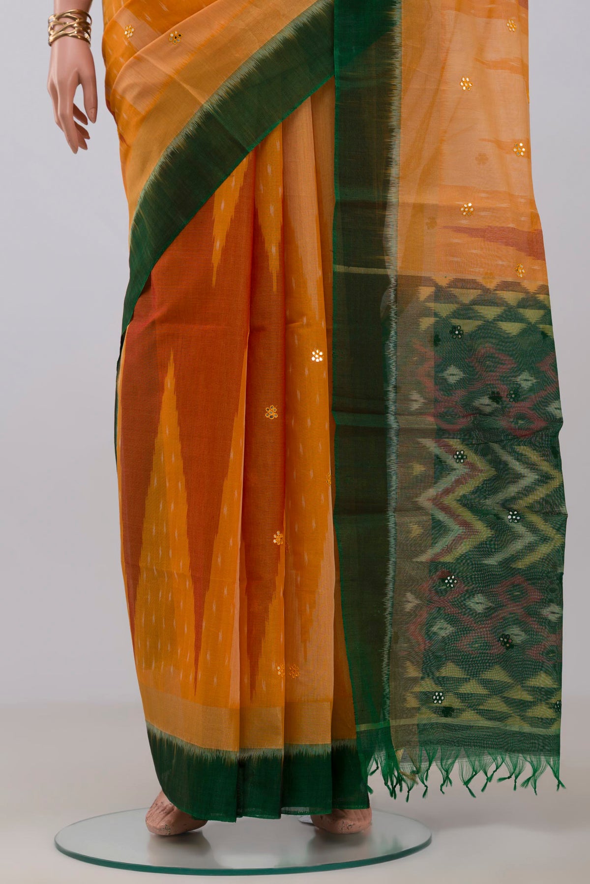 Pleats and pallu of Yellow Silk Cotton Saree with Ikat Print on the body and Paithani Border. 
