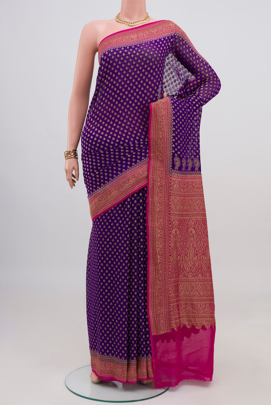 Violet Banarasi Georgette Saree with Zari Butta on the body and Zari Border.  displayed on a mannequin