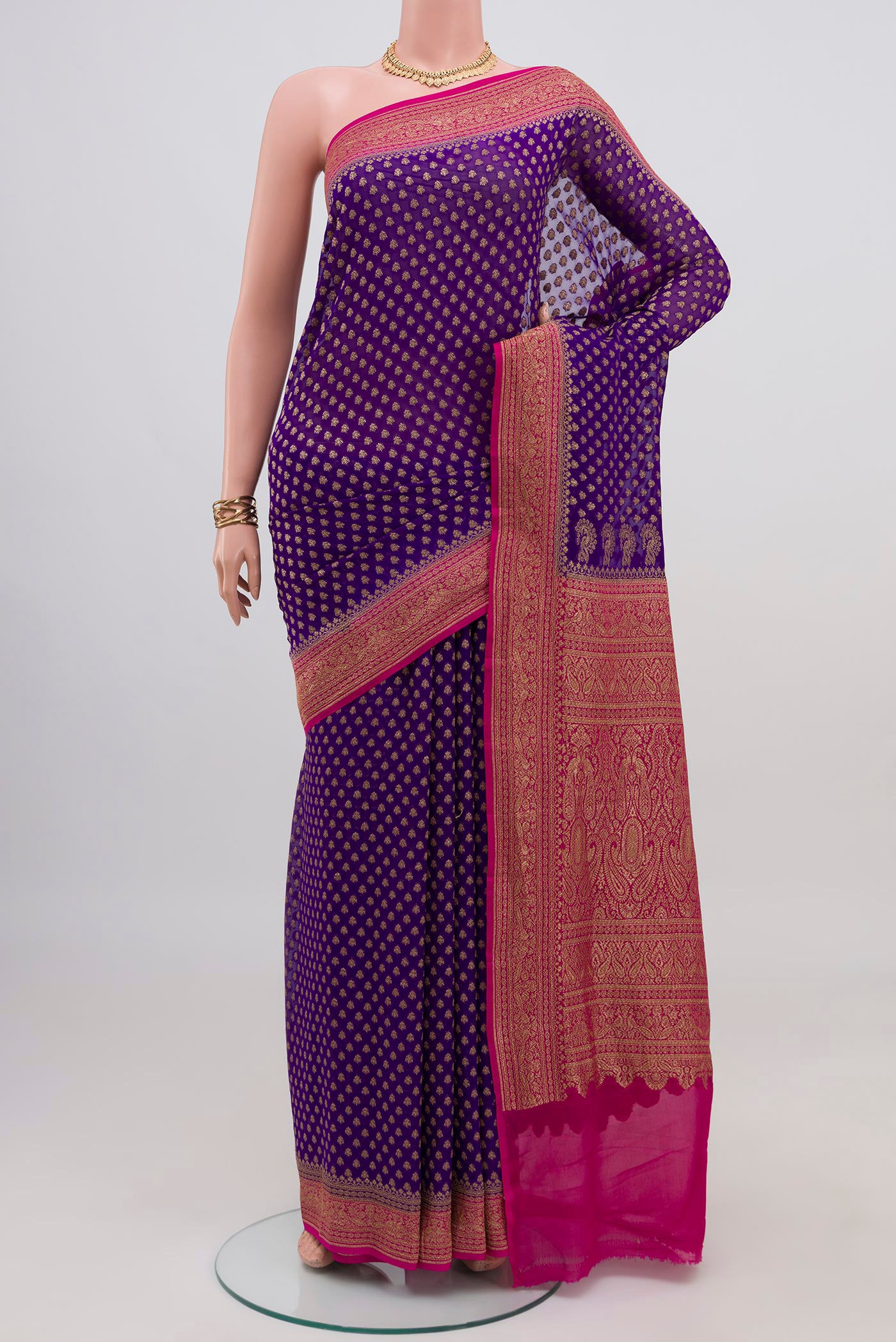 Violet Banarasi Georgette Saree with Zari Butta on the body and Zari Border.  displayed on a mannequin