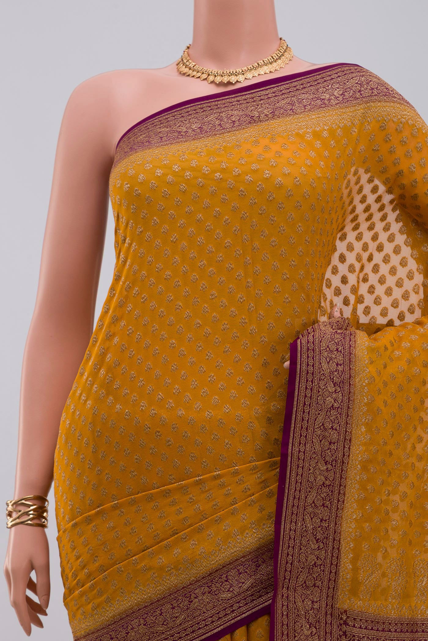 Border image of Yellow Georgette Saree with Fancy on the body and Fancy Border. 