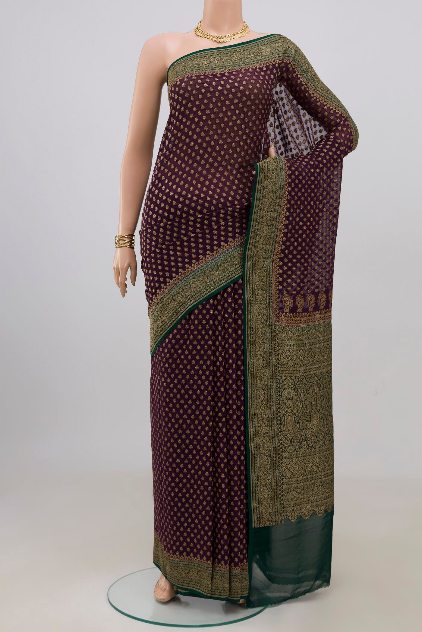 Purple Banarasi Georgette Saree with Zari Butta on the body and Zari Border.  displayed on a mannequin