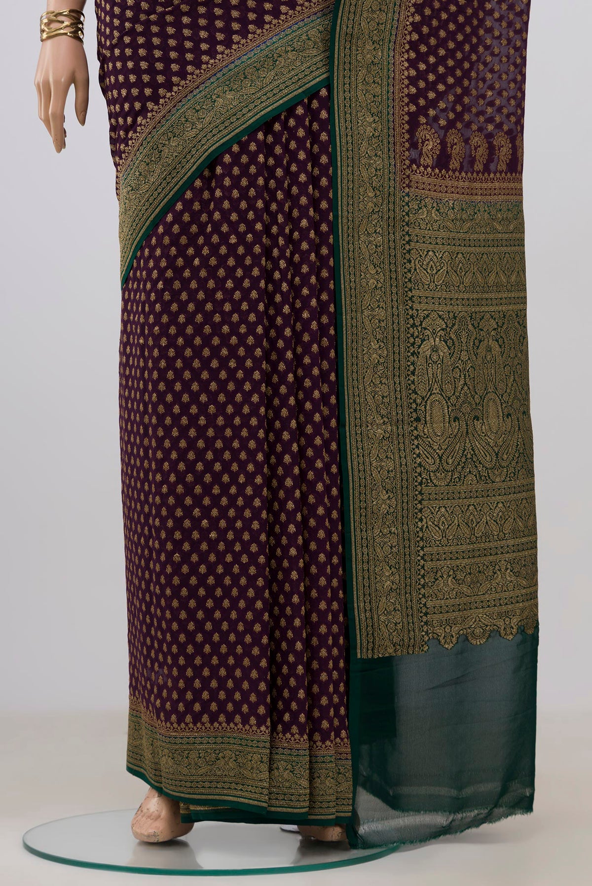 Pleats and pallu of Purple Banarasi Georgette Saree with Zari Butta on the body and Zari Border. 