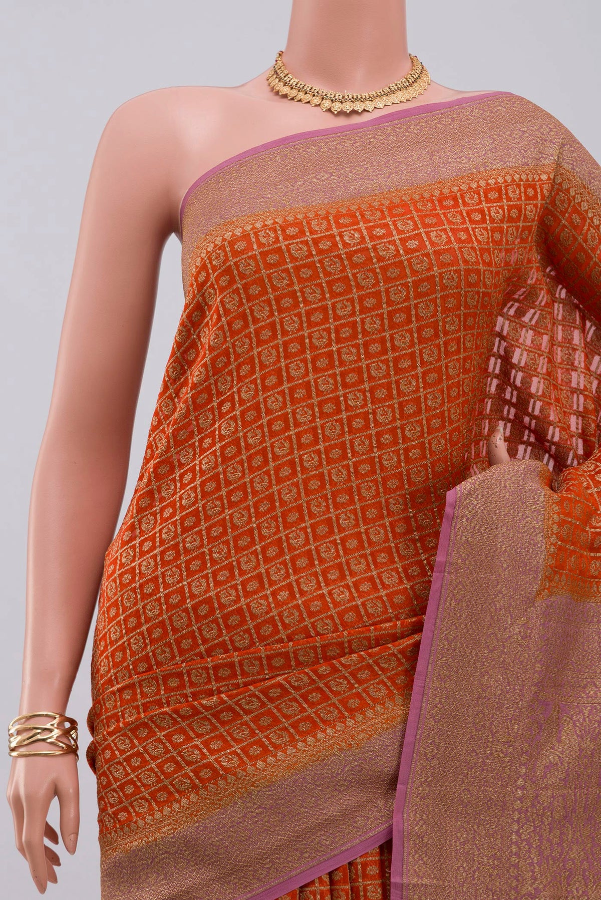 Border image of Orange Georgette Saree with Fancy on the body and Zari Border. 