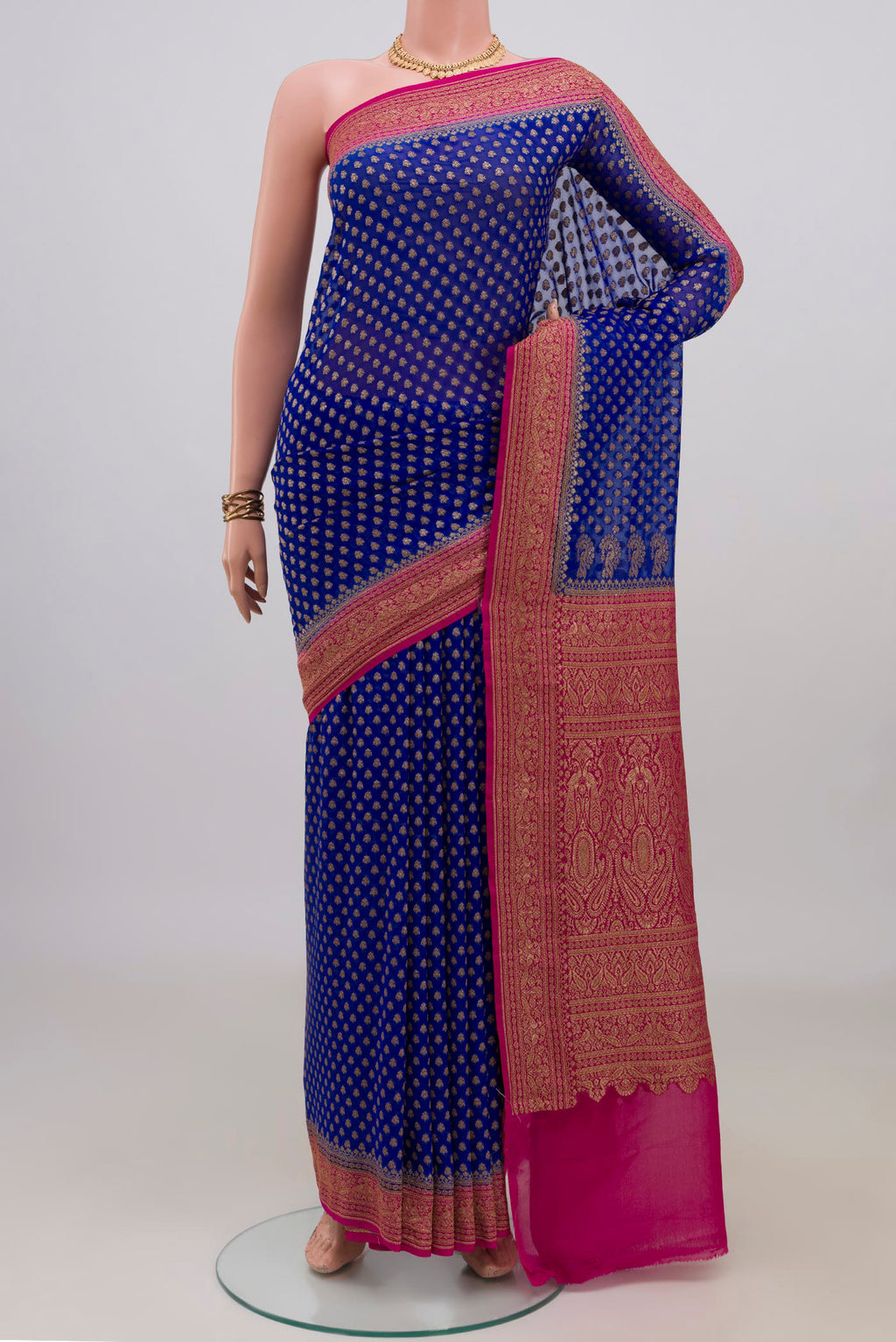 Blue Banarasi Georgette Saree with Zari Butta on the body and Zari Border.  displayed on a mannequin