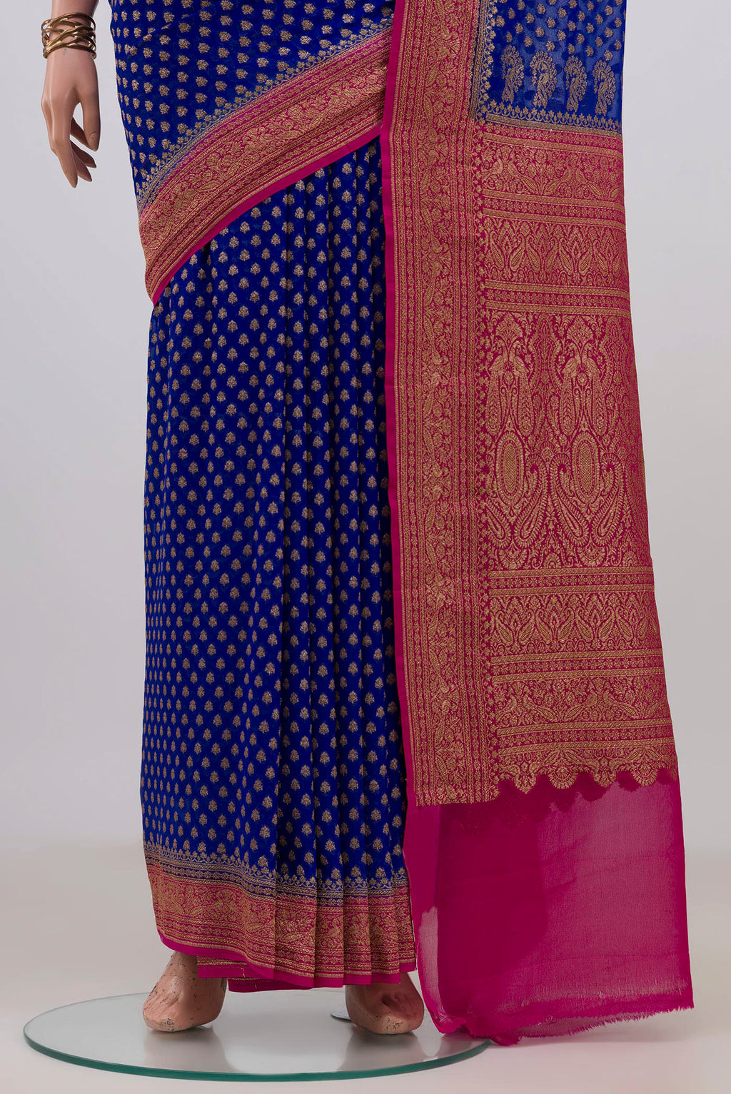 Pleats and pallu of Blue Banarasi Georgette Saree with Zari Butta on the body and Zari Border. 