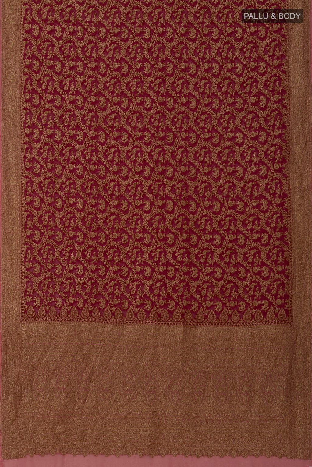 Flat view of Maroon Banarasi Georgette Saree with Zari Brocade on the body and Zig Zag Border. 