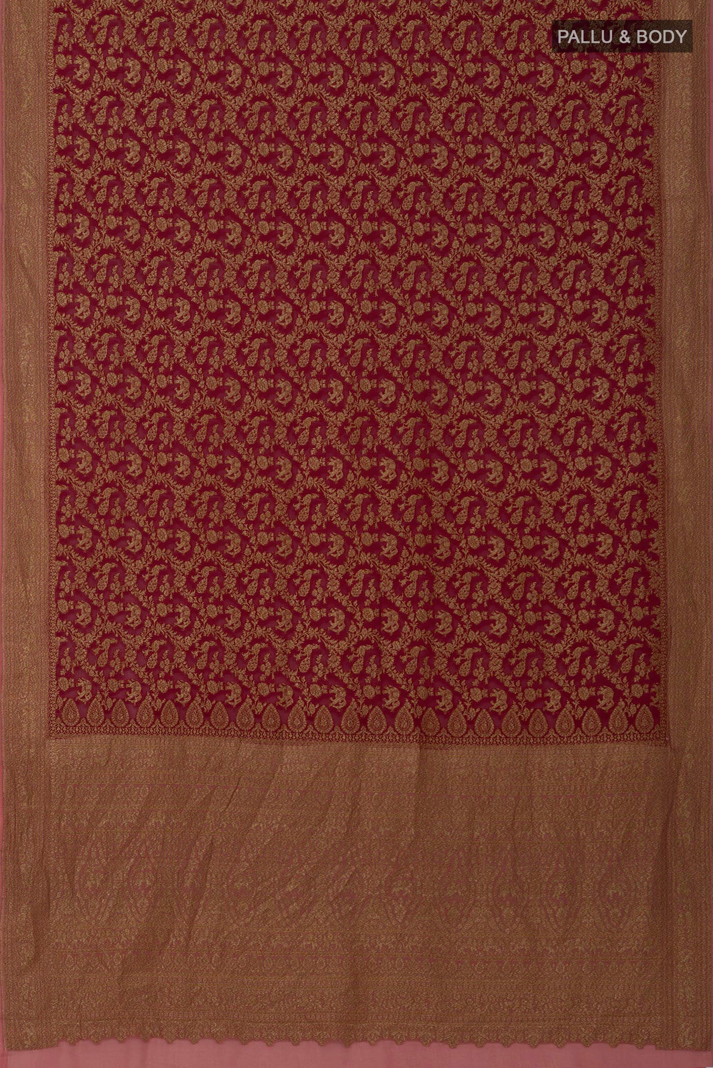 Flat view of Maroon Banarasi Georgette Saree with Zari Brocade on the body and Zig Zag Border. 