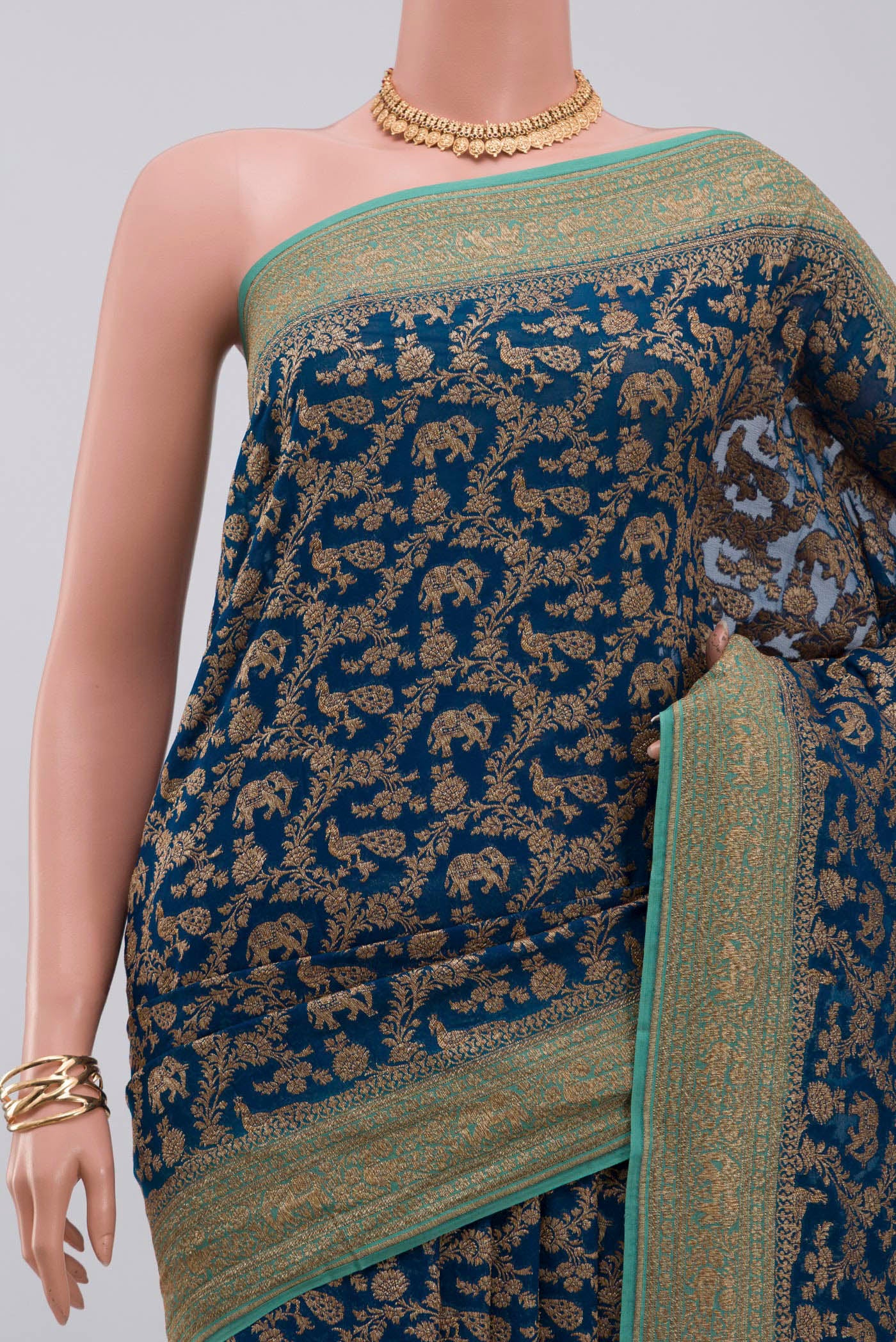 Border image of Blue Georgette Saree with Fancy on the body and Zari Border. 