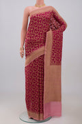 Pink Georgette Saree with Fancy on the body and Zari Border.  displayed on a mannequin