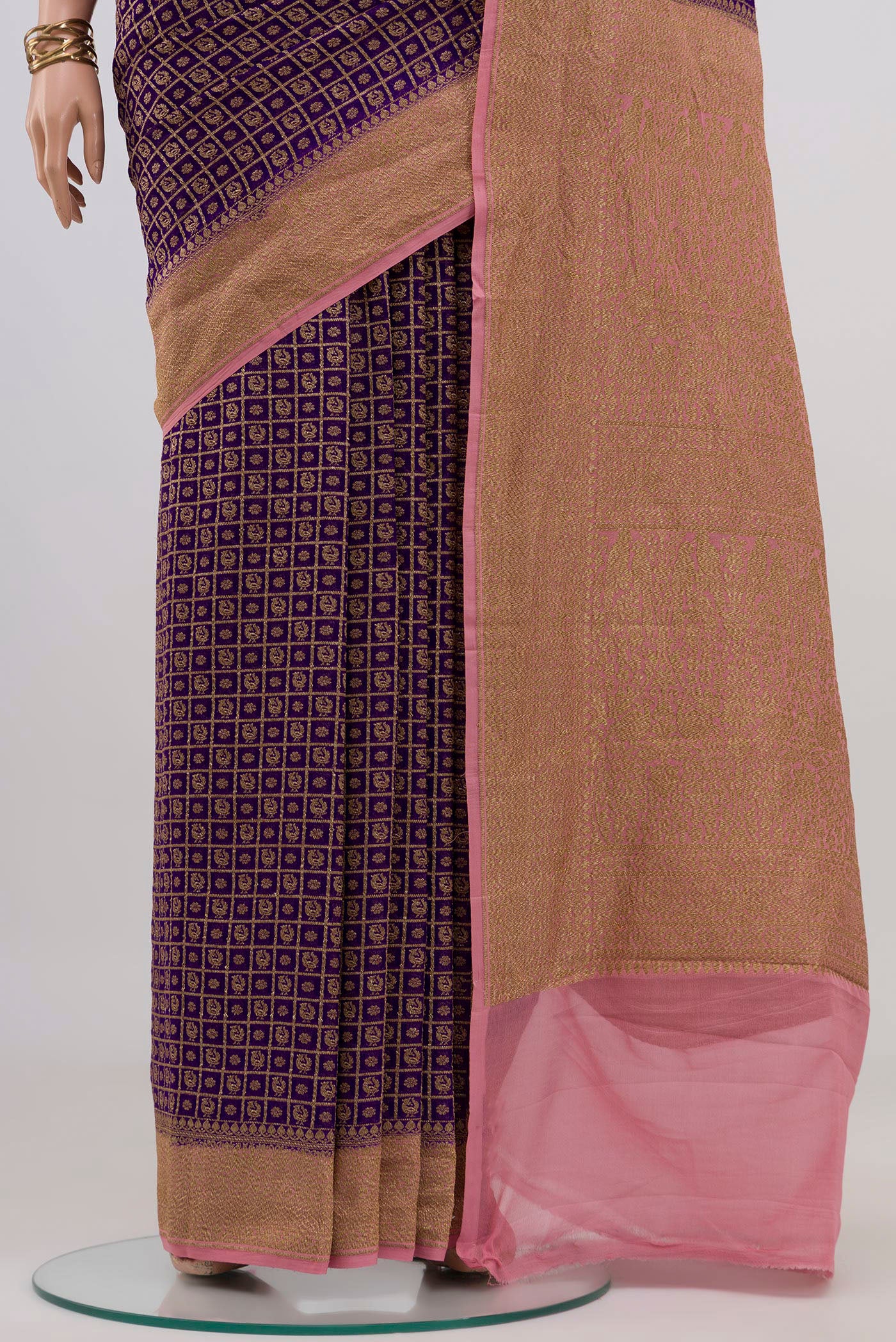 Pleats and pallu of Violet Banarasi Georgette Saree with Zari Brocade on the body and Zari Border. 