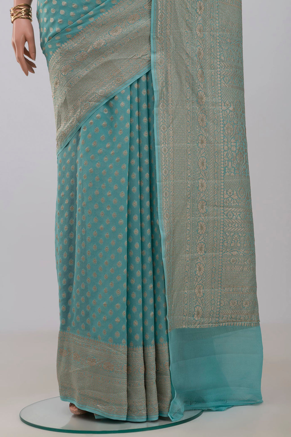 Pleats and pallu of Blue Georgette Saree with Fancy on the body and Fancy Border. 