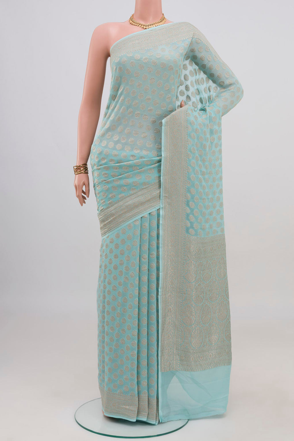 Light Blue Banarasi Georgette Saree with Zari Brocade on the body and Zari Border.  displayed on a mannequin