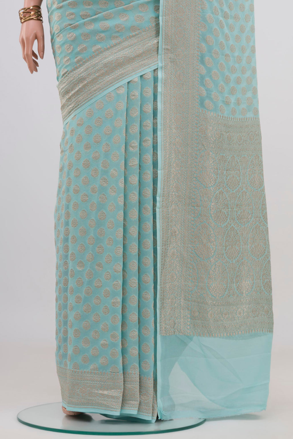Pleats and pallu of Light Blue Banarasi Georgette Saree with Zari Brocade on the body and Zari Border. 