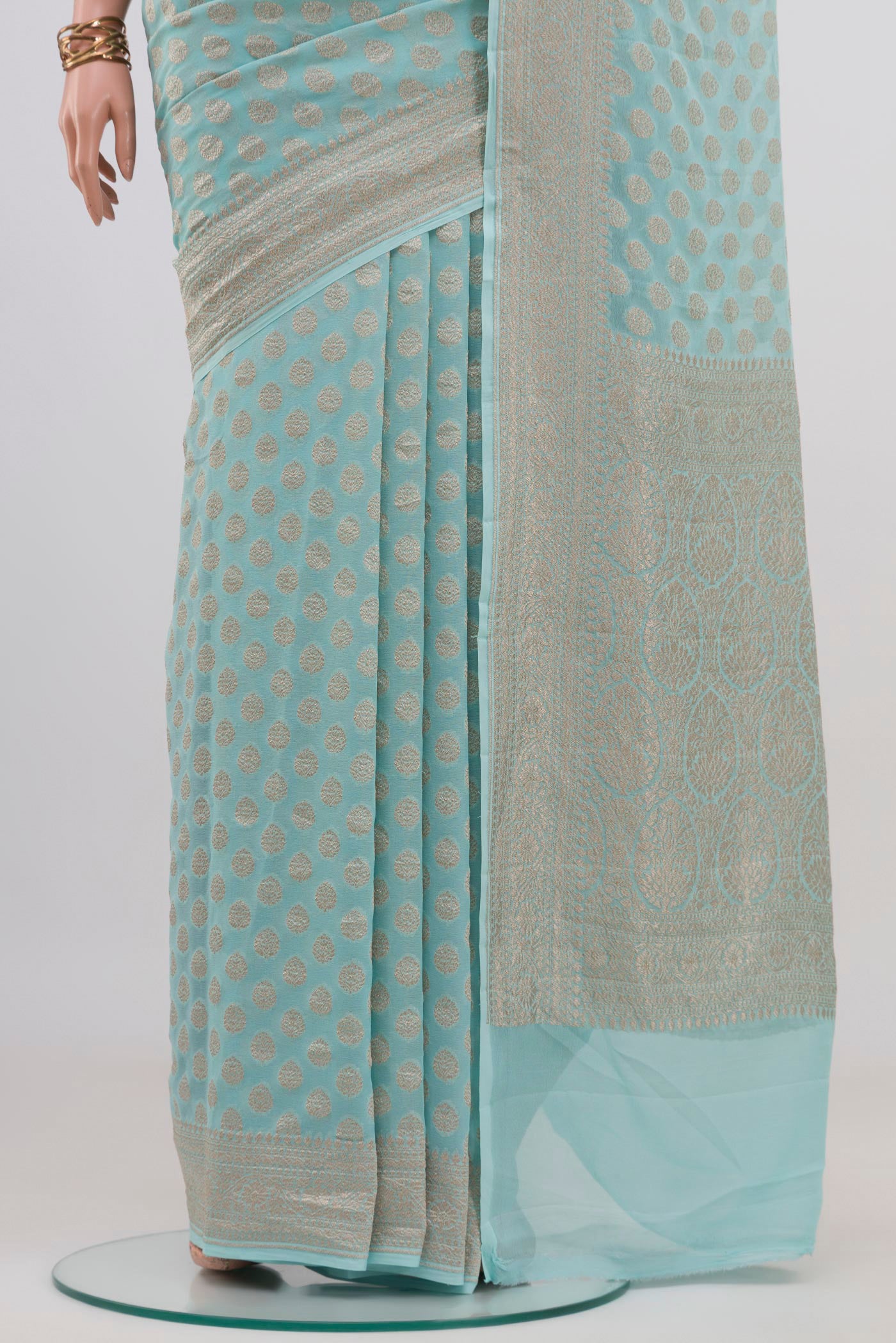 Pleats and pallu of Light Blue Banarasi Georgette Saree with Zari Brocade on the body and Zari Border. 