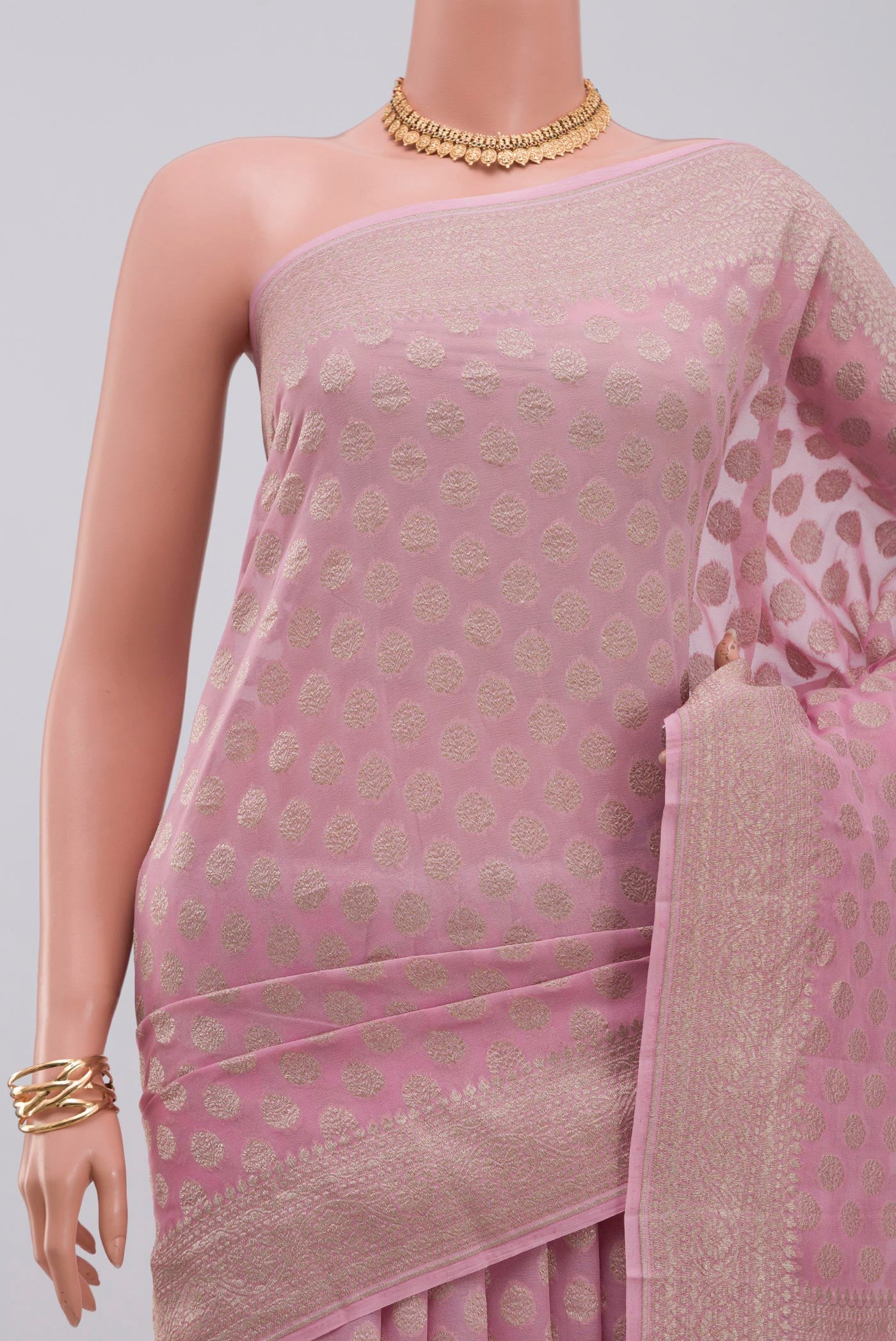 Border image of Pink Georgette Saree with Fancy on the body and Zari Border. 