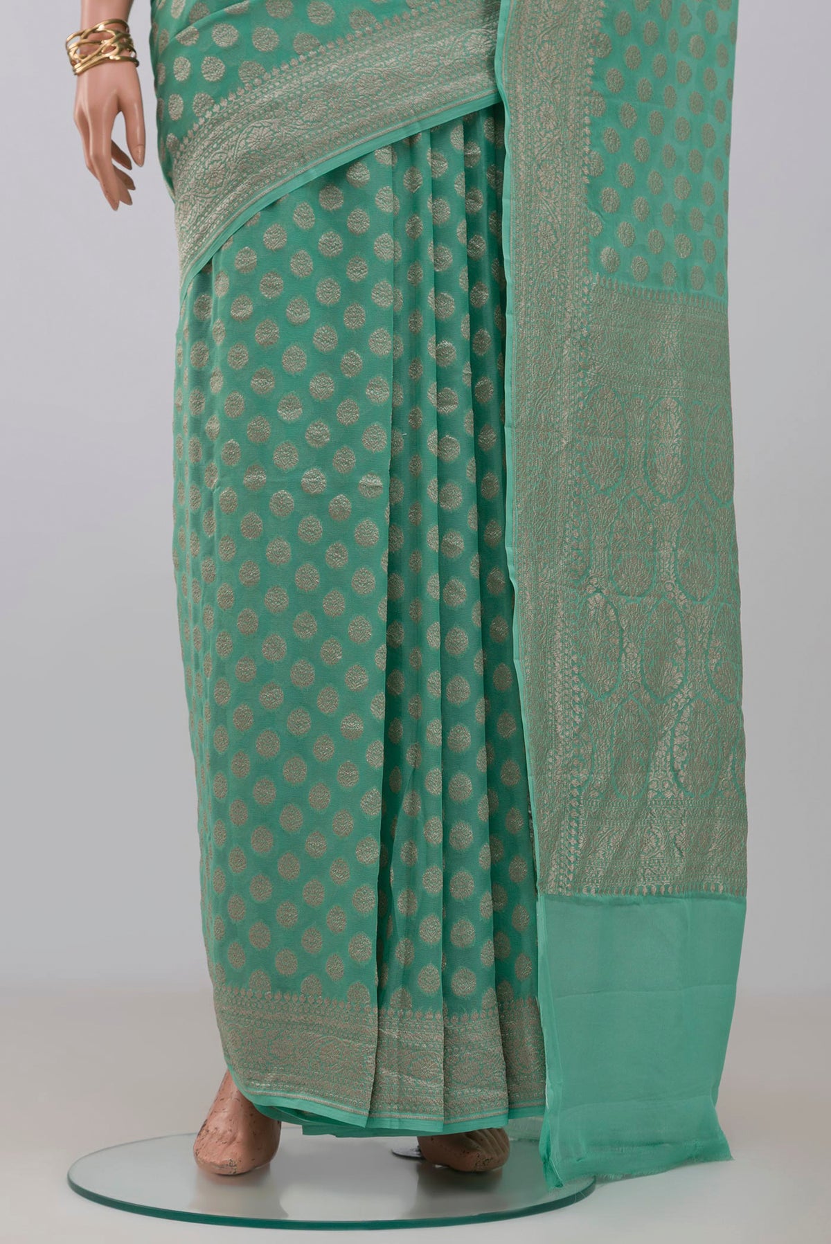 Pleats and pallu of Blue Georgette Saree with Fancy on the body and Fancy Border. 