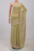 Green Georgette Saree with Fancy on the body and Zari Border.  displayed on a mannequin