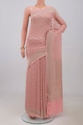 Pink Georgette Saree with Fancy on the body and Fancy Border.  displayed on a mannequin