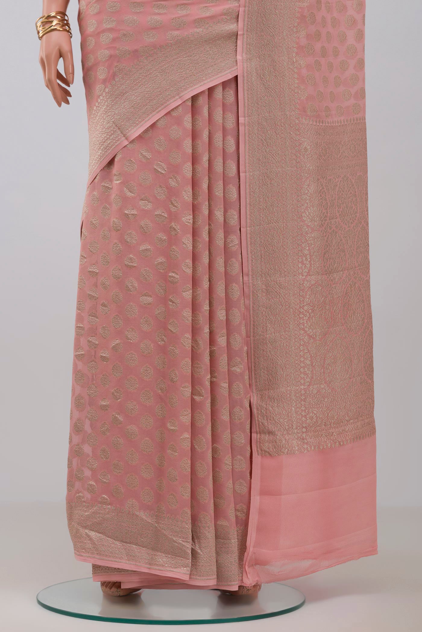 Pleats and pallu of Pink Georgette Saree with Fancy on the body and Fancy Border. 