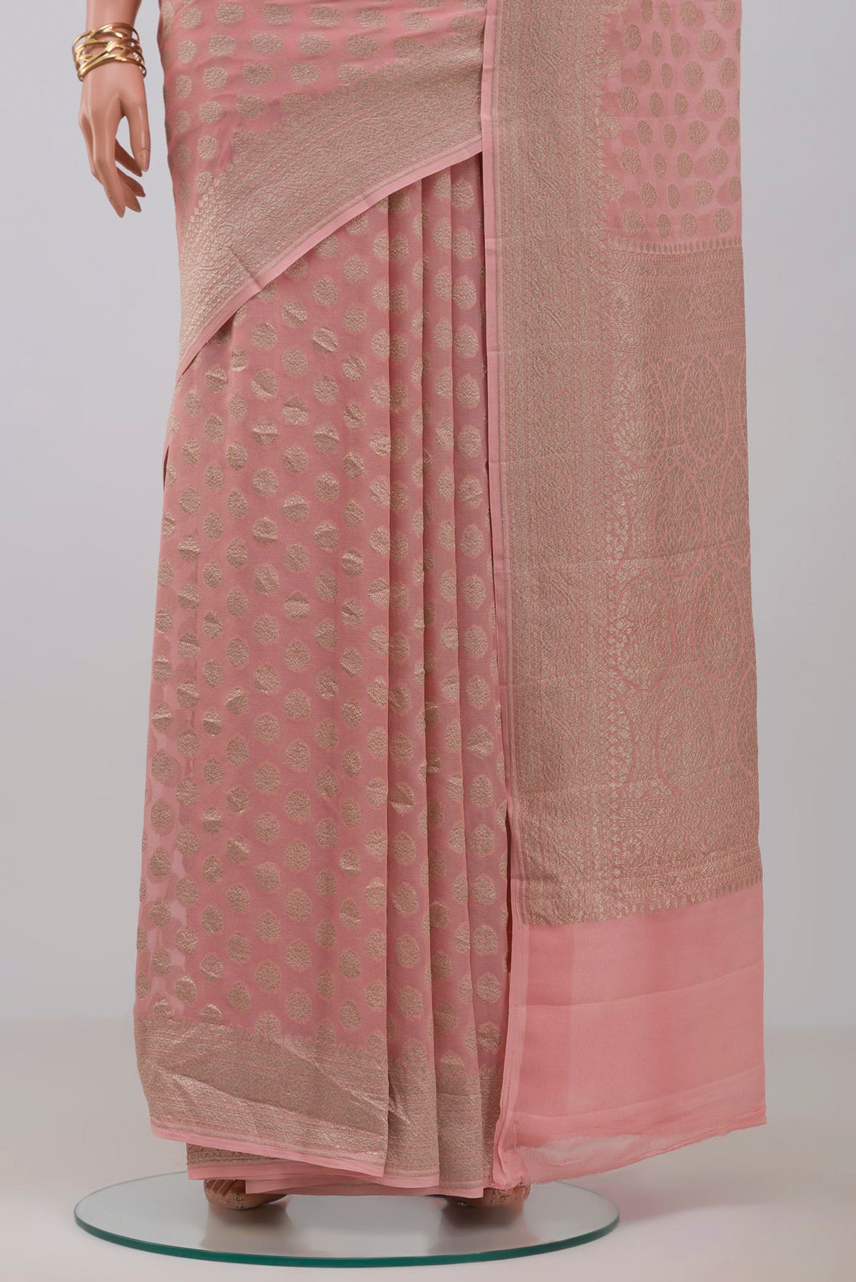 Pleats and pallu of Pink Georgette Saree with Fancy on the body and Fancy Border. 