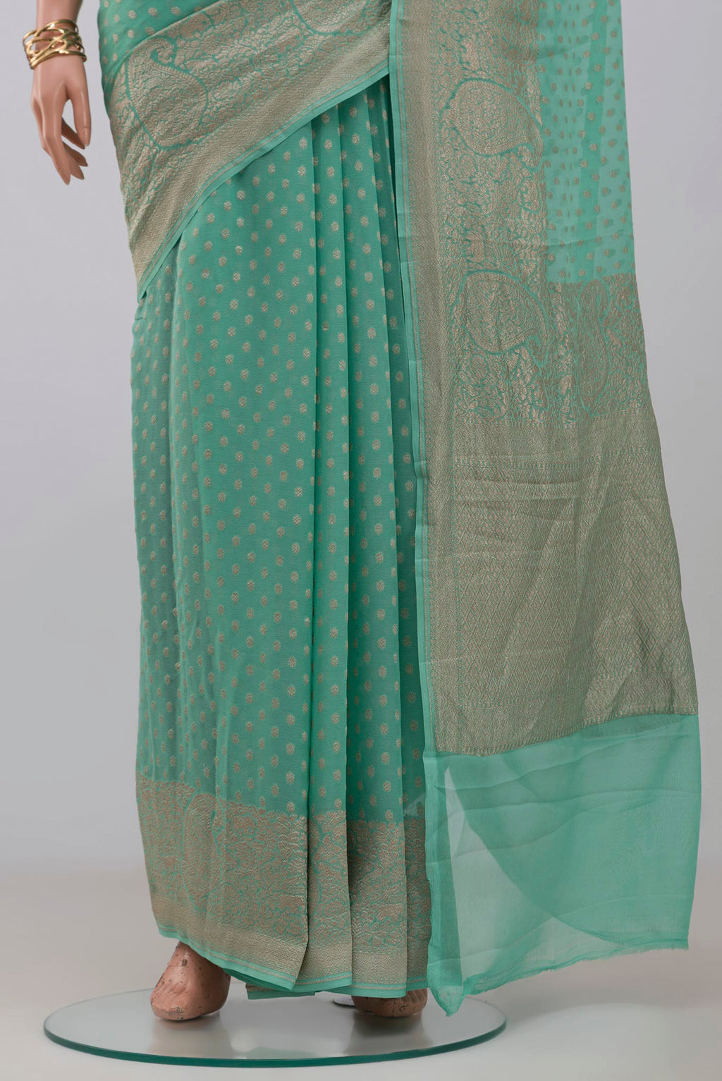 Pleats and pallu of Blue Georgette Saree with Fancy on the body and Fancy Border. 
