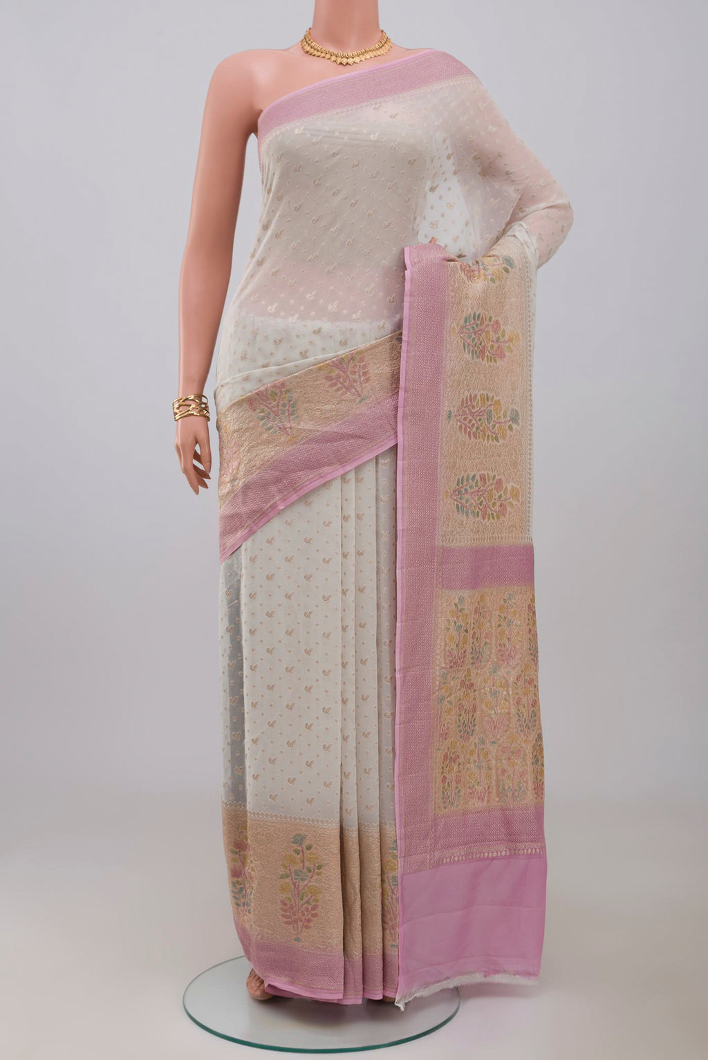 White Georgette Saree with Fancy on the body and Fancy Border.  displayed on a mannequin