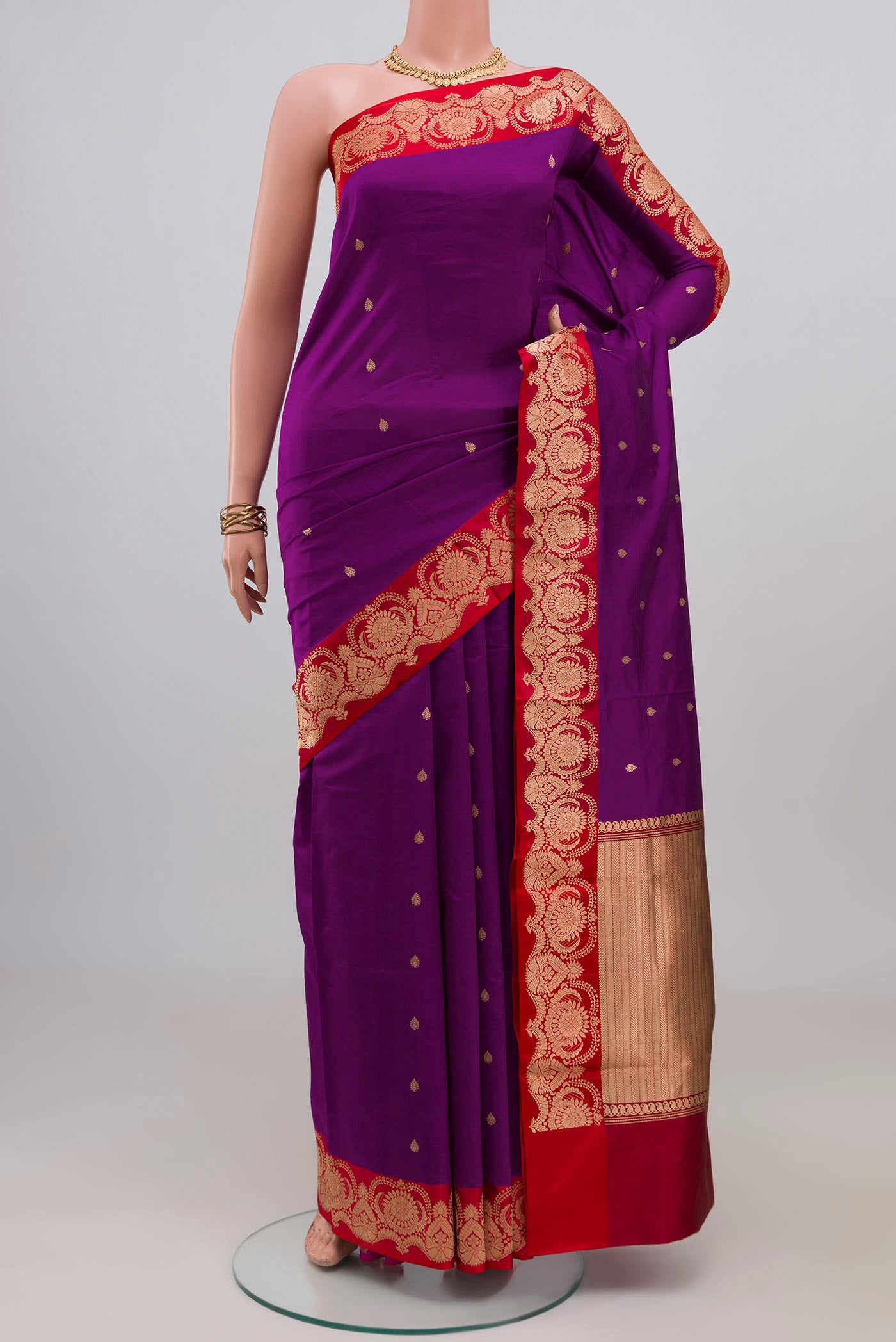 Purple Banarasi Katan Silk Saree with Zari Butta on the body and Fancy Border.  displayed on a mannequin