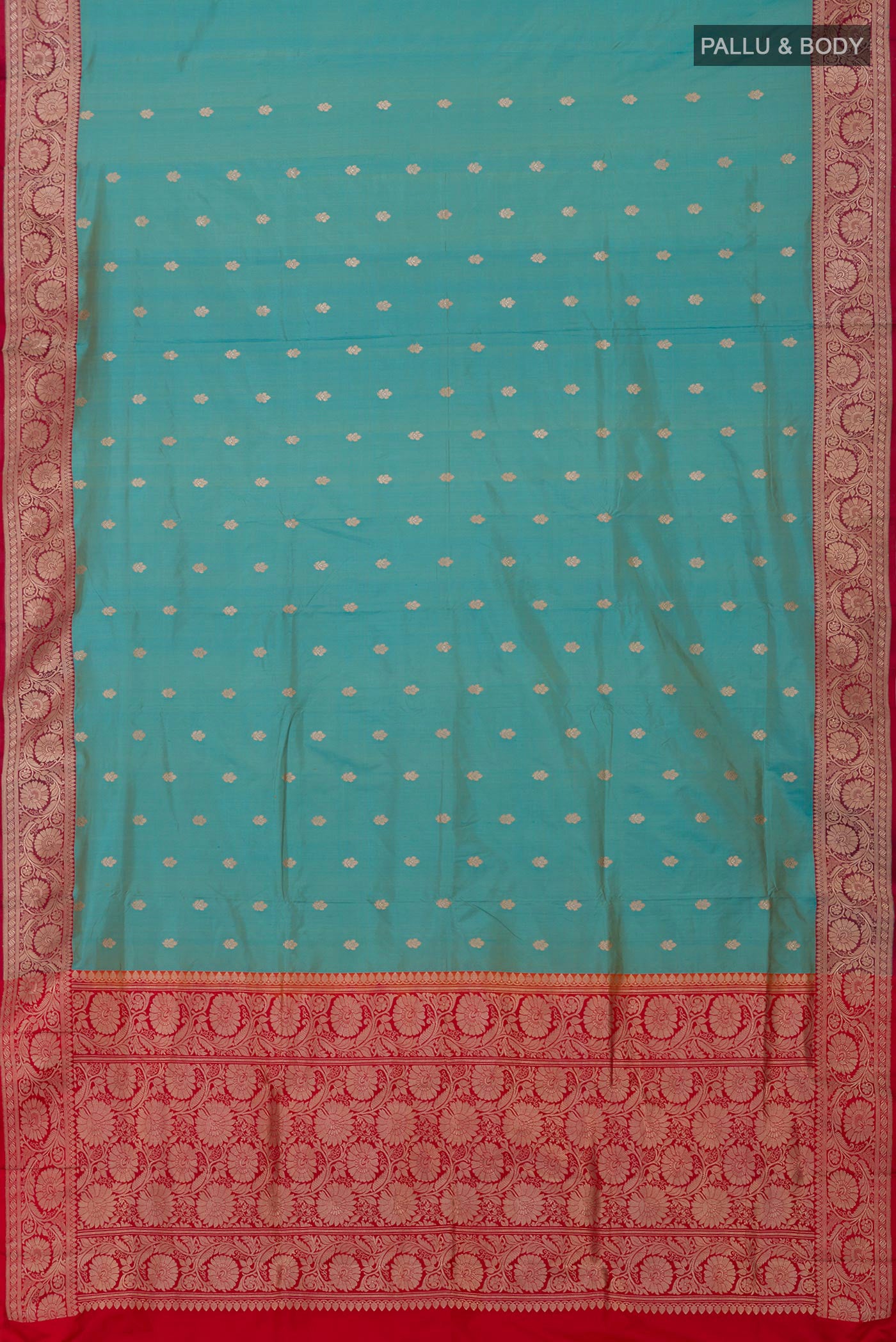 Flat view of Blue Banarasi Katan Silk Saree with Zari Butta on the body and Zari Border. 