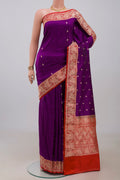 Purple Banarasi Katan Silk Saree with Zari Butta on the body and Fancy Border.  displayed on a mannequin