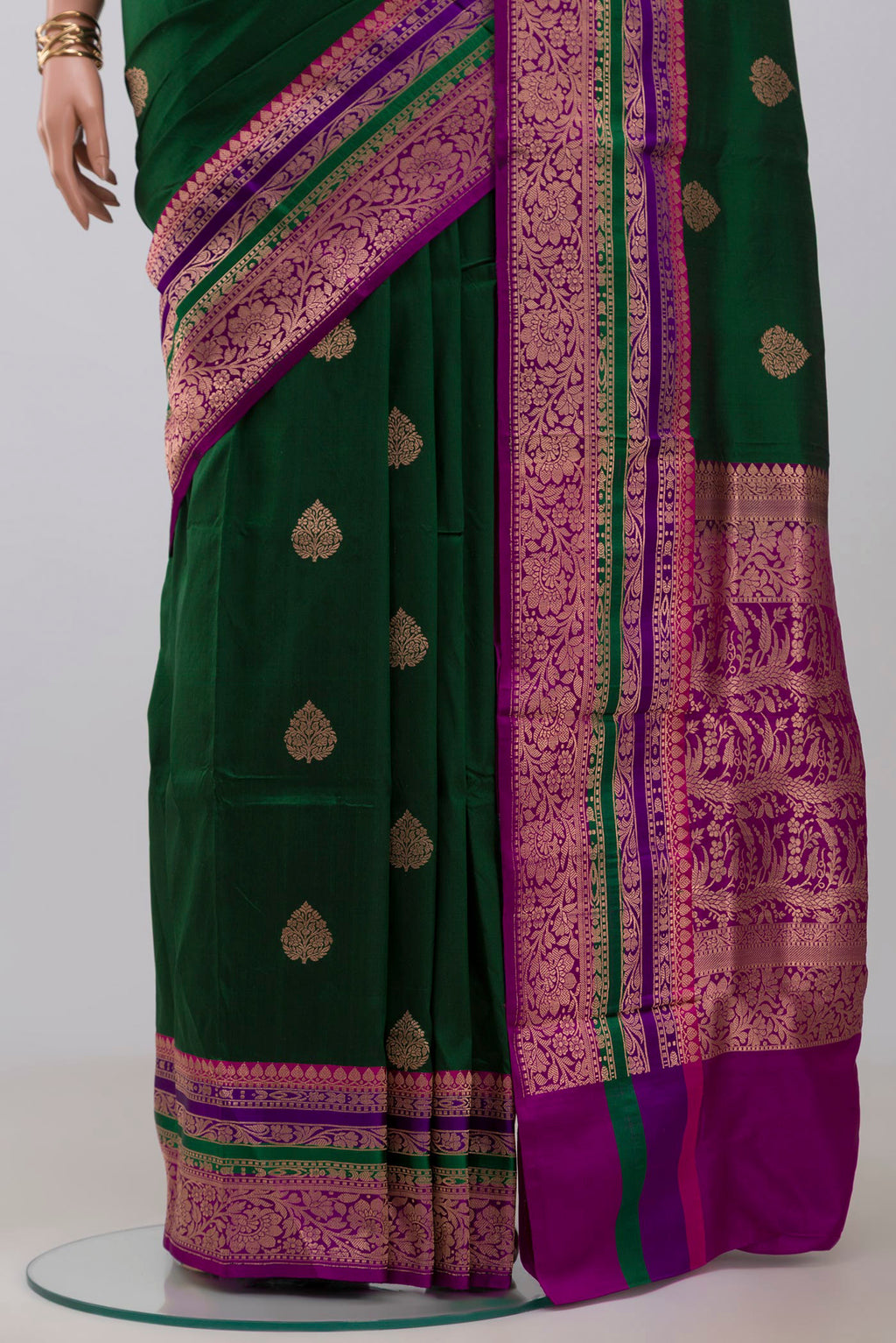 Pleats and pallu of Green Banarasi Katan Silk Saree with Zari Butta on the body and Fancy Border. 