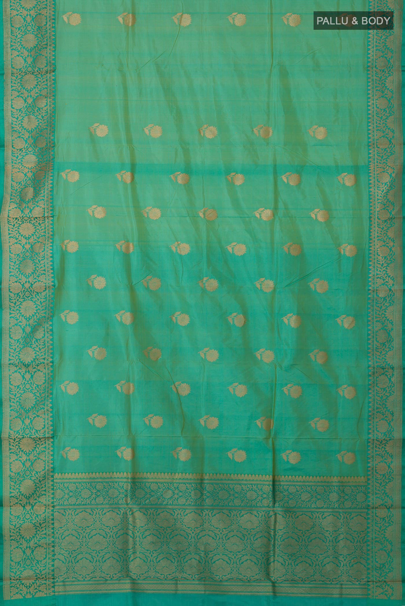 Flat view of Light Green Banarasi Katan Silk Saree with Zari Butta on the body and Zari Border. 